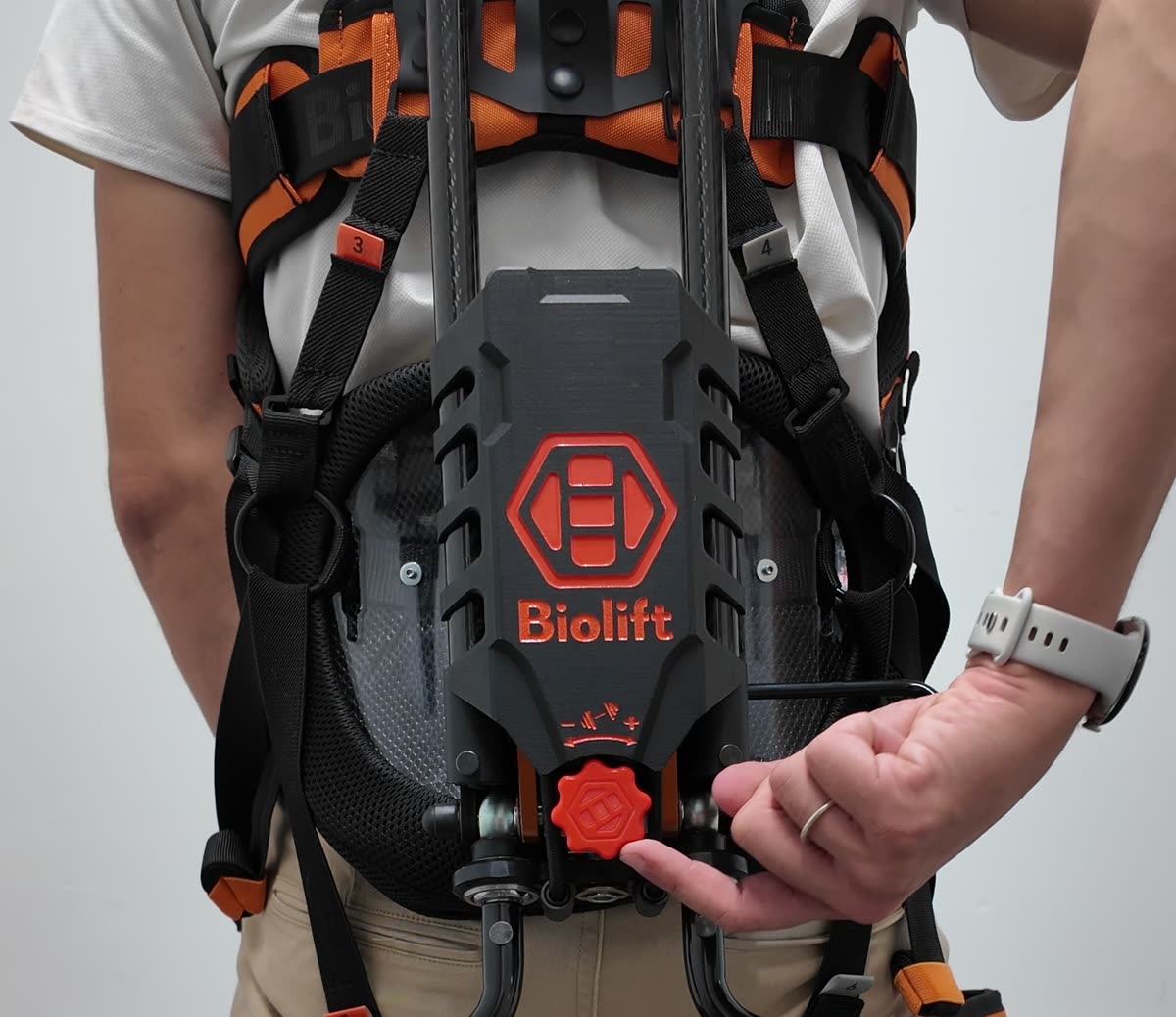 Back of the Biolift exoskeleton: mechanism, logo and force dial